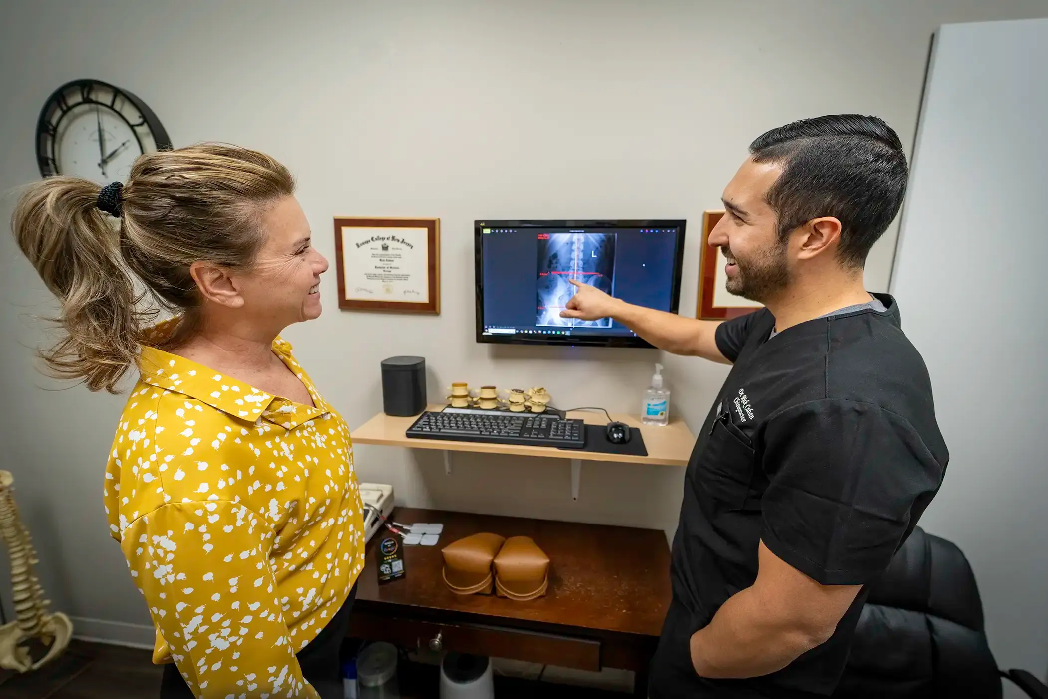 Chiropractor performing a spinal adjustment on a patient