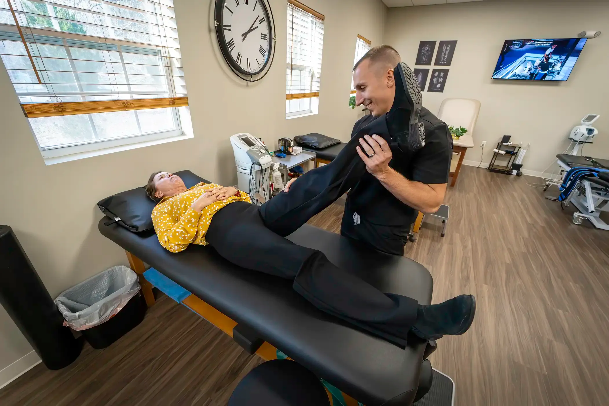 Patient working with a physical therapist on rehabilitation exercises